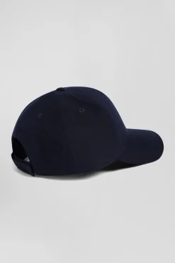 Casquette bleu marine emblème nœud papillon