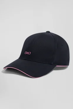 Casquette en coton bleu marine badge nœud papillon passepoil rose