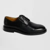 Derbies lacés en cuir noir