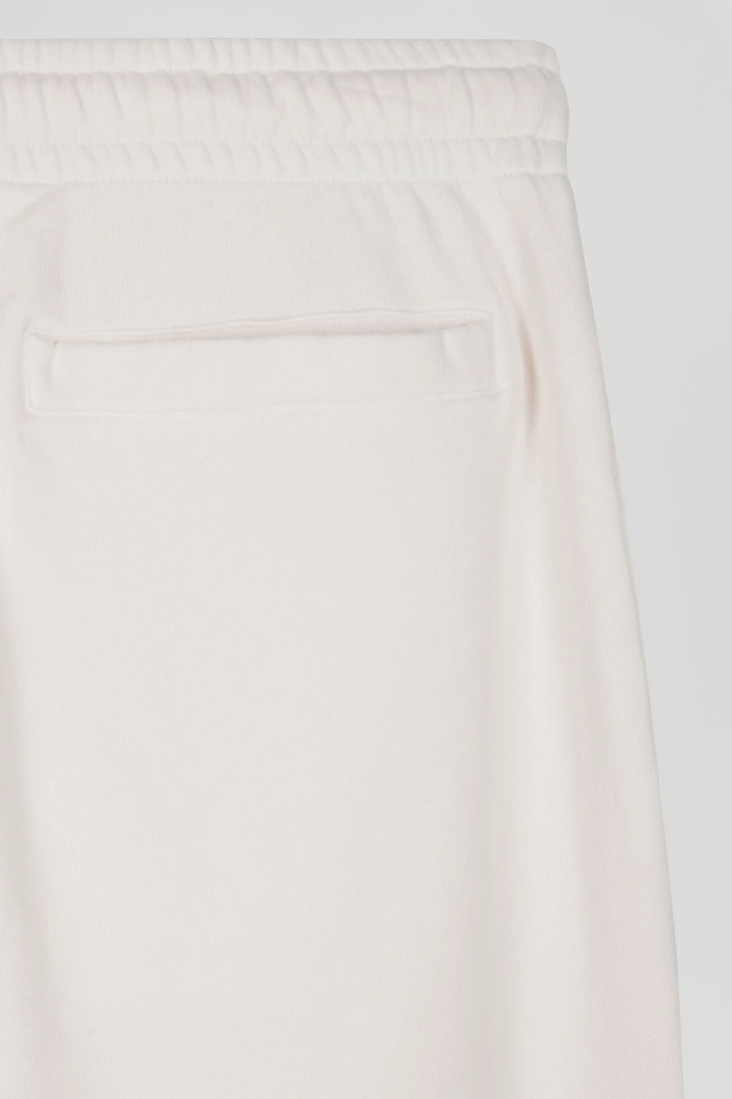 Jogging unisexe en molleton coton écru surteint coupe Relaxed