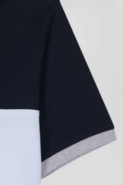 Polo manches courtes en piqué coton ciel détails contrastés broderie nœud papillon coupe Regular