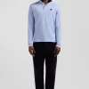 Polo manches longues en piqué coton ciel écusson gomme coupe Regular