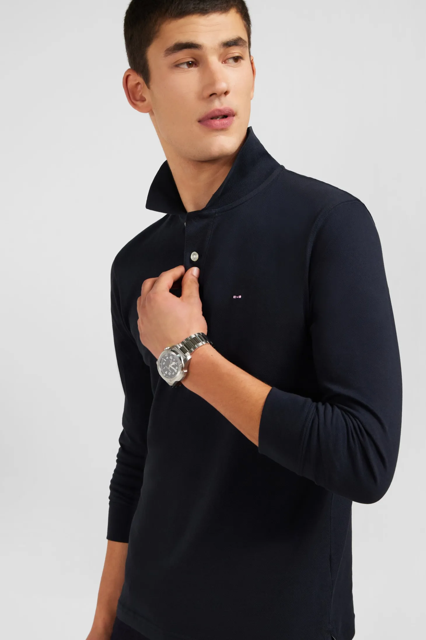Polo manches longues noir uni en piqué de coton stretch