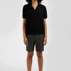 Pull manches courtes à col polo en laine noir coupe Regular